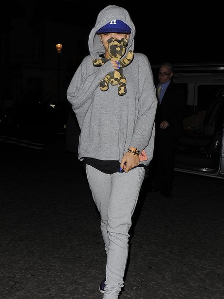 Rita Ora arrives in England holding a toy bear