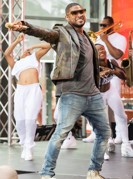 Usher performs on stage