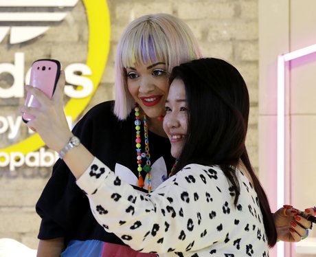 Rita Ora takes a selfie with a fan
