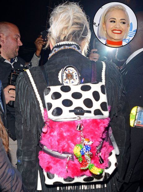 Rita Ora wearing a strange back pack