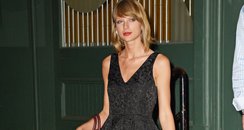 Taylor Swift wearing a black dress