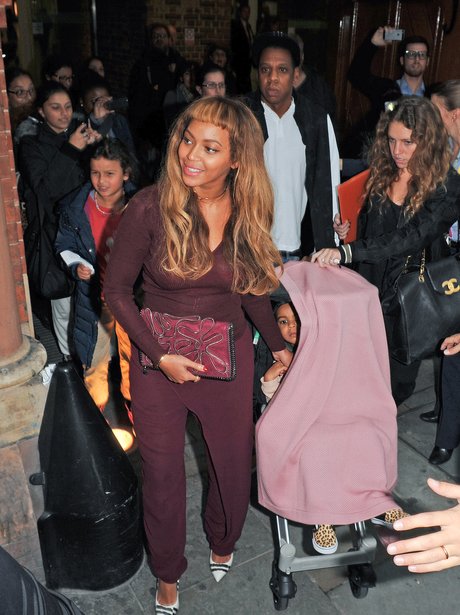 Beyonce with new fringe arriving in London