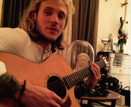 Dougie Poynter playing the giutar