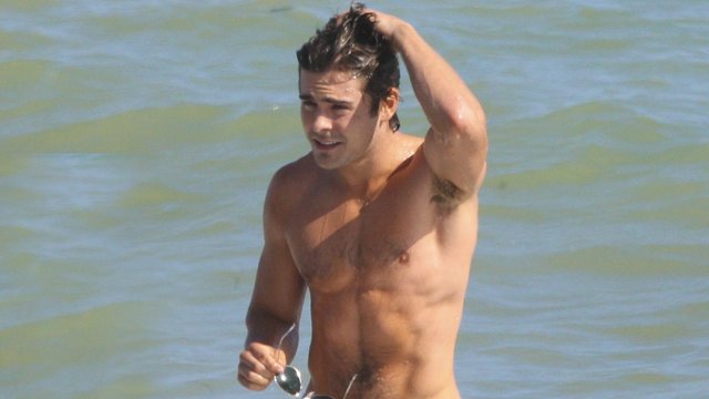Zac Efron topless on the beach on holiday 