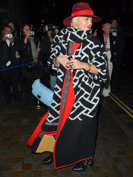 Rita Ora wearing a big coat