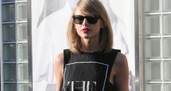 Taylor wears t shirt