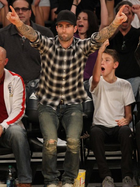 Adam Levine watching ther basketball
