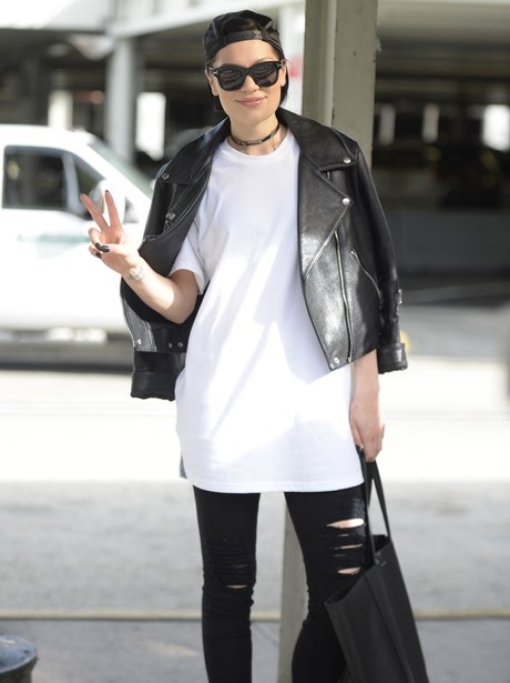 Jessie J wearing a leather jacket