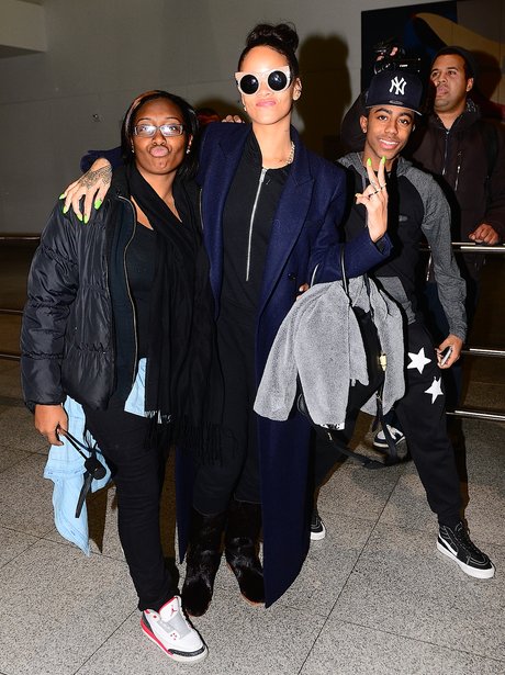 Rihanna with a fan at the airport