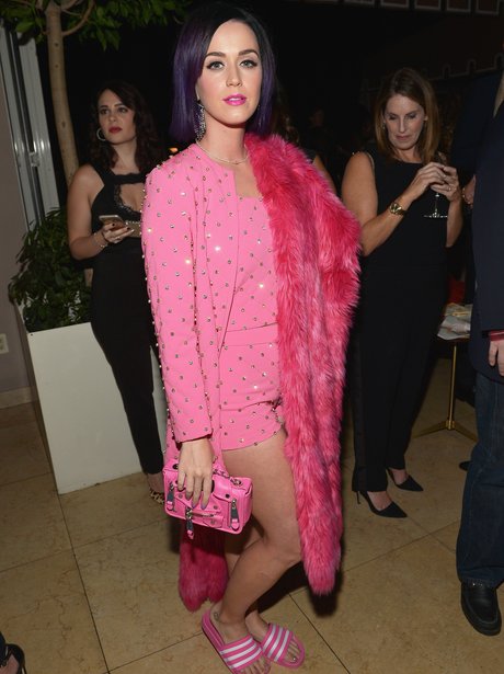 Katy perry wearing a pink outfit with sandals