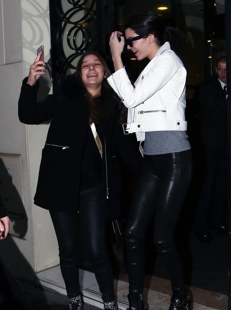Kendall Jenner taking a selfie with a fan