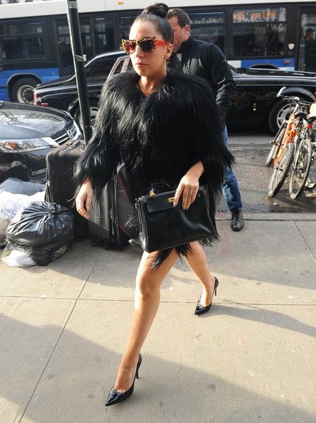 Lady Gaga wearing a black fur coat