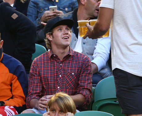 Niall Horan watching the tennis