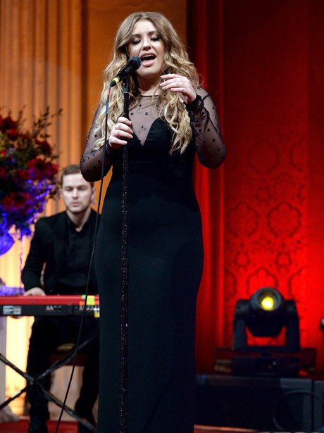Ella Henderson wearing a long black dress