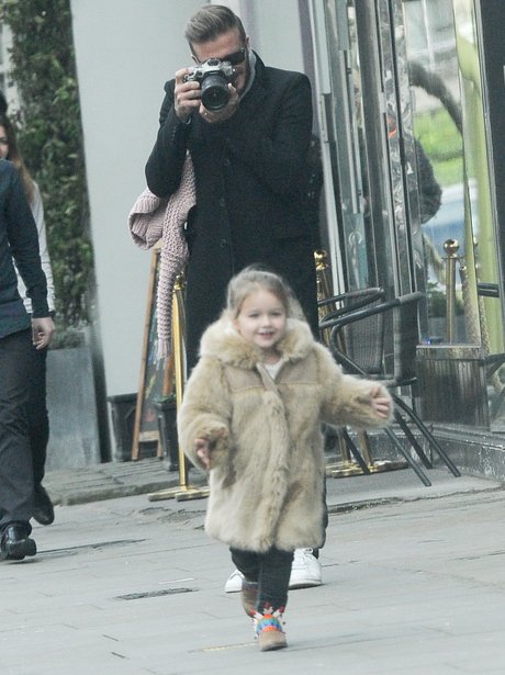 David Beckham taking a picture of Harper