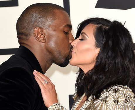 Kanye West and Kim Kasdashian kiss