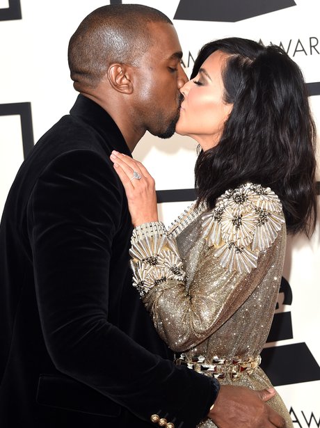 Kanye West and Kim Kasdashian kiss 
