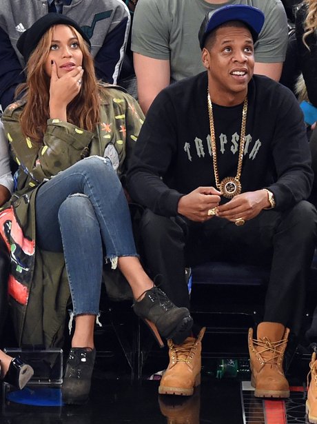 Beyonce and Jay Z watching the basketball