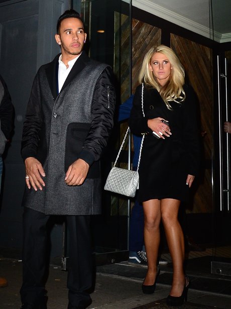 Lewis Hamilton and mystery woman leaving club