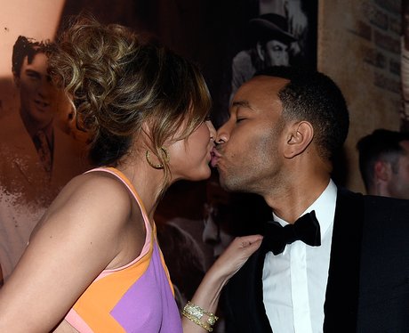 Chrissy Teigen kisses John Legend