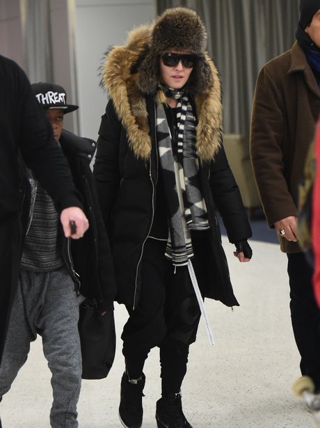 Maodnna covered up at the airport