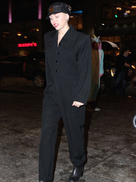 Miley Cyrus wearing a black suit