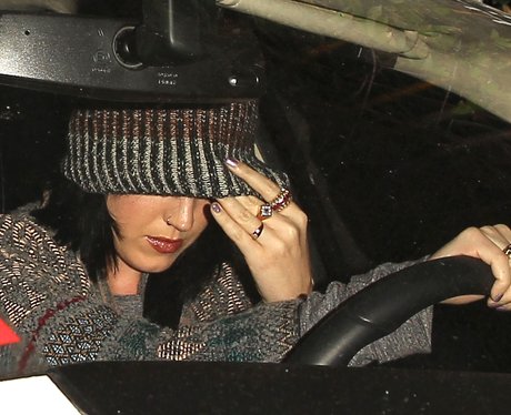 Katy Perry in a beanie driving