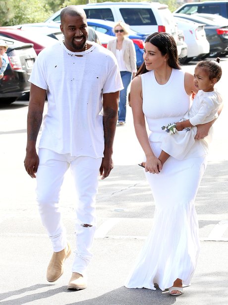 Kanye West and Kim Kasdashian with North
