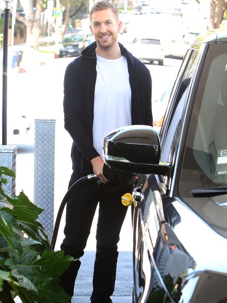 Calvin Harris filling his car with petrol