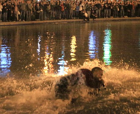 Kanye West jumps into water