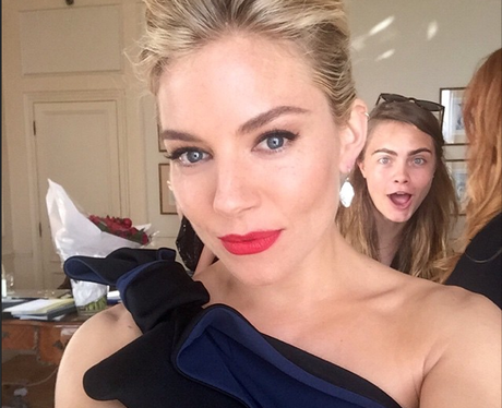 Sienna Miller and Cara Delevingne Photobomb