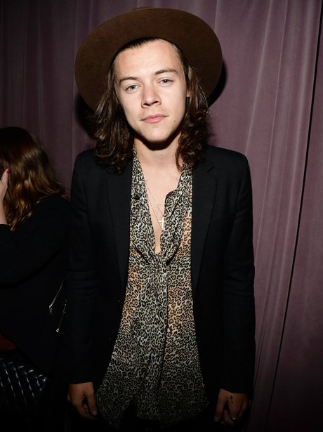 Harry styles wearing a leopard print shirt