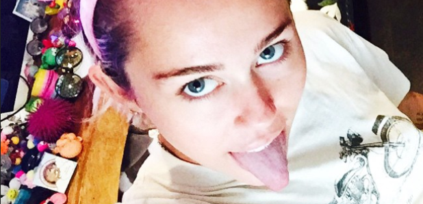 Miley Cyrus wearing mouse ears 