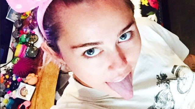 Miley Cyrus wearing mouse ears 