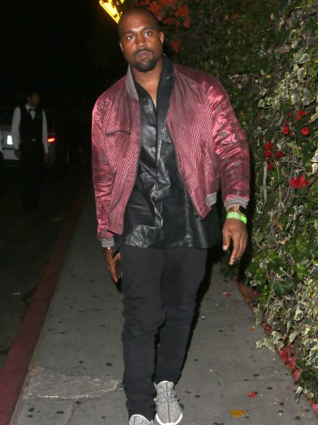 Kanye West on a night out wearing a metalic jacket