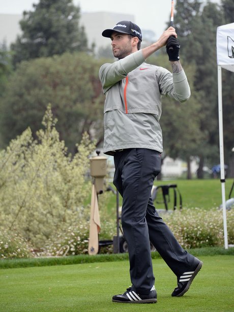 Adam Levine playing golf