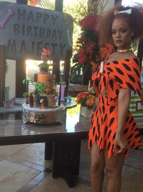 Rihanna dresses as a flintstone character