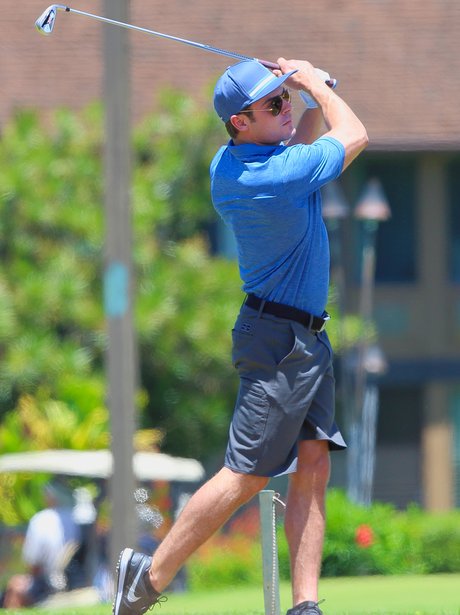 Zac Efron playing golf