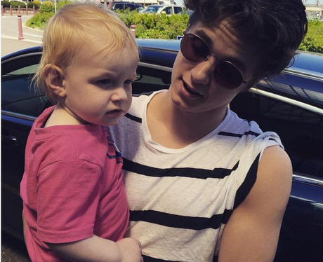 Brad Simpson with a baby Instagram