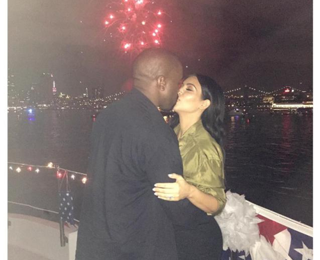 Kim Kardashian and Kanye West kiss at 4th July cel
