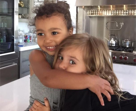 North West cuddling her cousin Penelope Disick