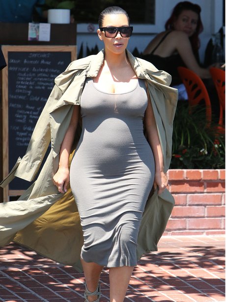Kim Kardashian shows off baby bump