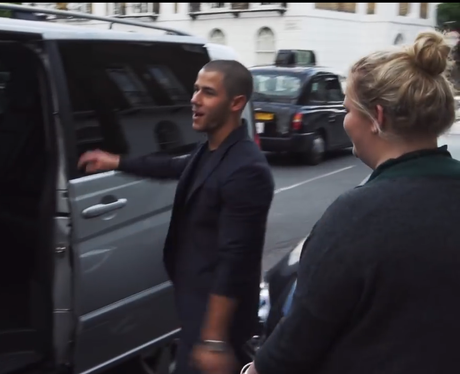 Nick Jonas picks up a fan in car