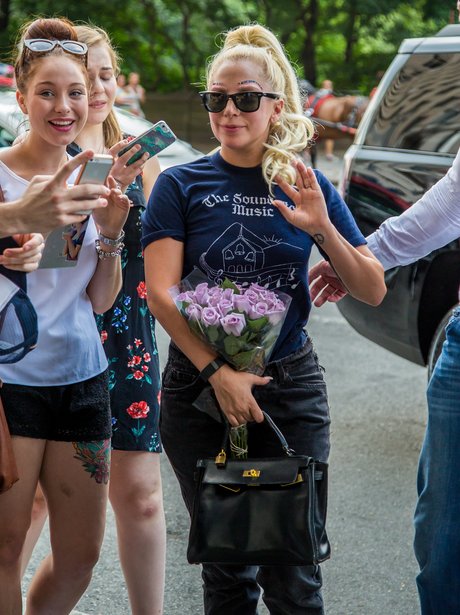 Lady Gaga with flowers and fans