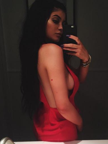 Kylie Jenner wearing a red dress