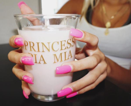 Pia Mia holding candle
