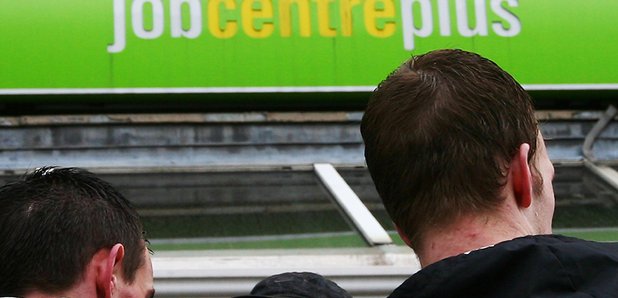 A pair of jobseekers look for work at a job centre