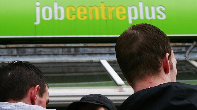 A pair of jobseekers look for work at a job centre