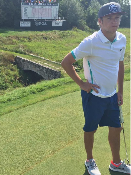 Niall Horan playing golf