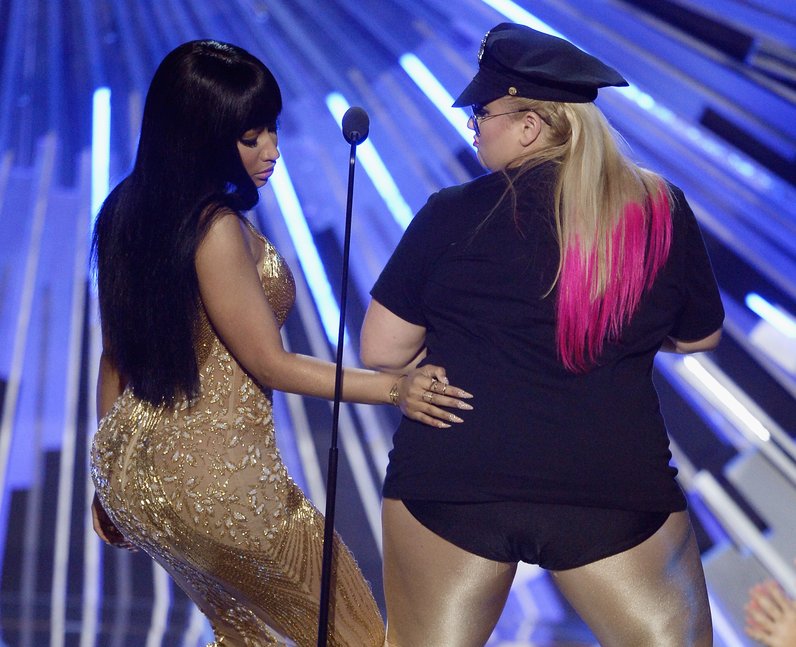 Nicki Minaj slaps Rebel Wilson's bum on stage at t